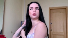 Moaning Brunette in White Lingerie Orgasms on Webcam