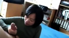 Mature Asian Strokes a Cock