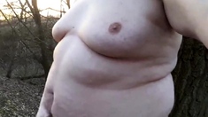 Chubby masturbates in the woods