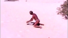 Tanned guy on beach in tiny string thong (temporarily!)